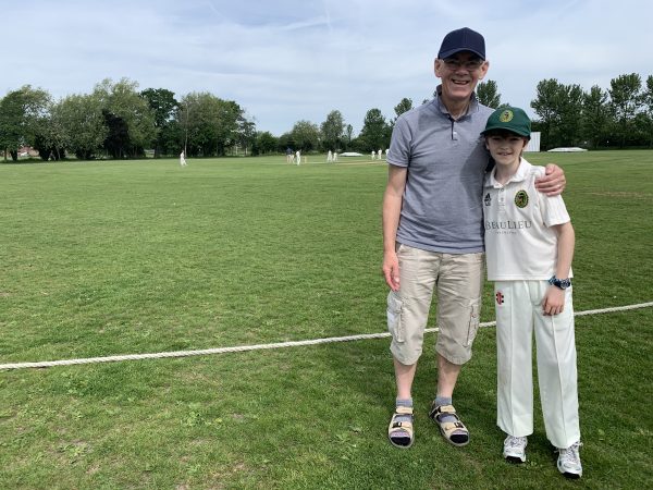 Barrie and Alex in his cricket kit